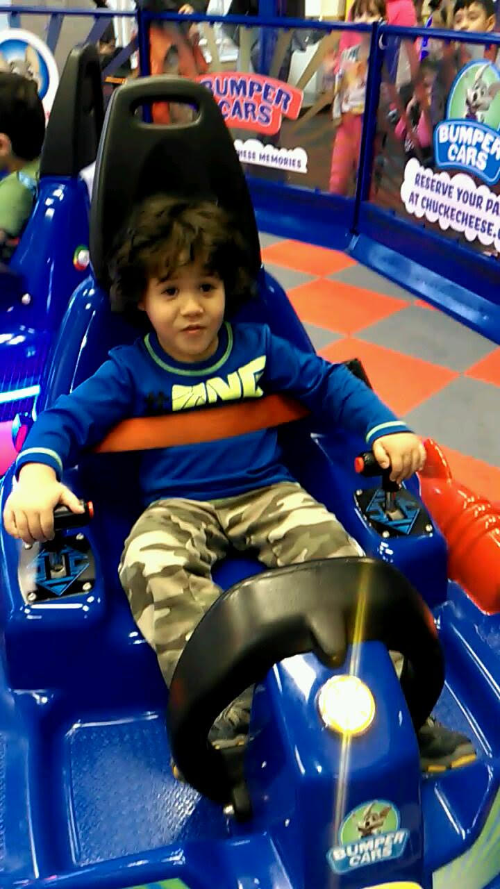 My son on the bumper cars at Chuckie Cheese