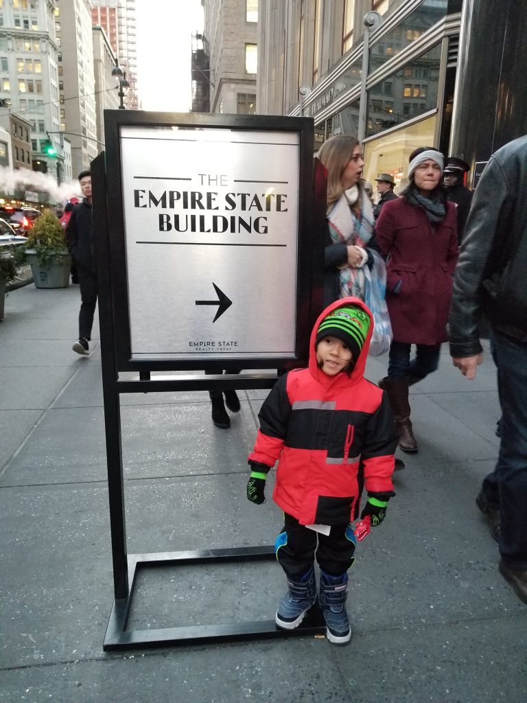 Xavier in front of Empire State Building Christmas Time 2018