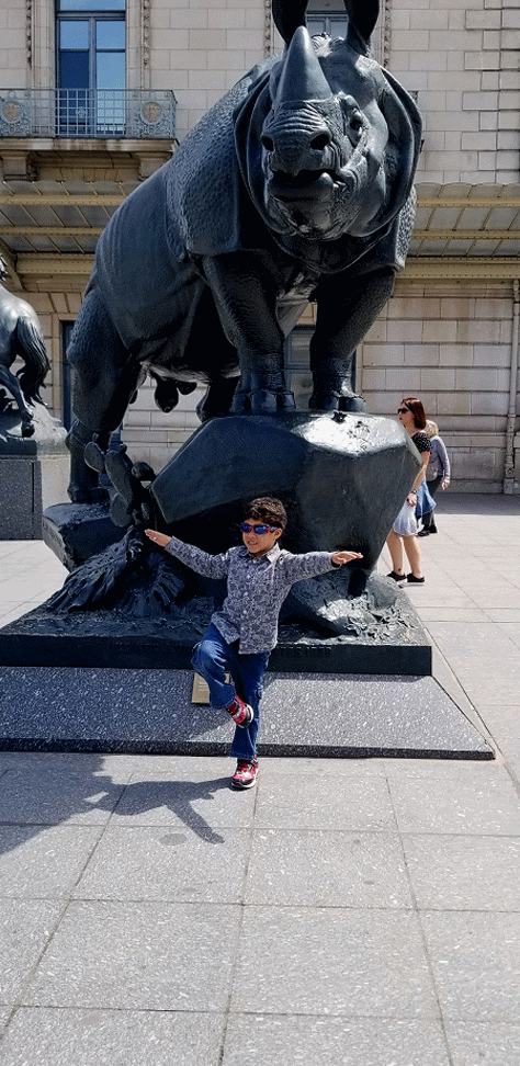 My-son-Xavier-in front of rhino statue-Musée-dOrsay-May-2019